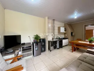 Foto de uma sala de estar com cozinha aberta em Lajeado.