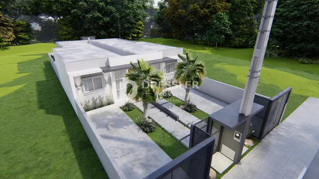 Fachada de uma casa moderna com jardim verde bem cuidado.