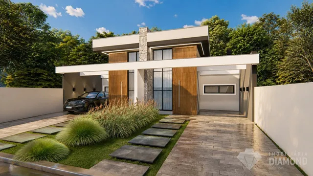 Fachada moderna de uma casa em Lajeado, Brasil, com jardim e garagem.