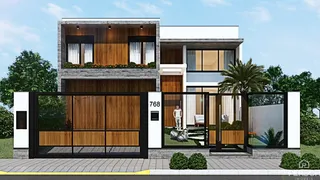 Fachada moderna de uma casa em Lajeado, Brasil, com portão de ferro e detalhes em madeira.