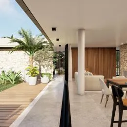 Ambiente interno com piso de madeira e coluna branca em uma residência.