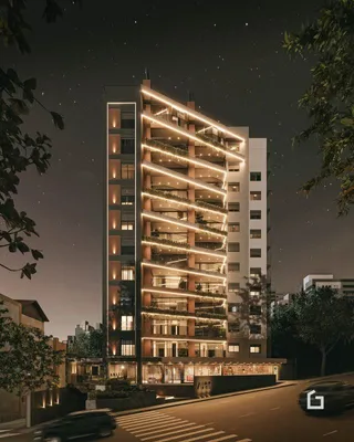 Fachada de um prédio residencial em Lajeado, Brasil, à noite.