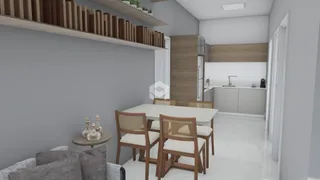 Ambiente interno moderno com mesa de jantar e sala de estar em Lajeado.