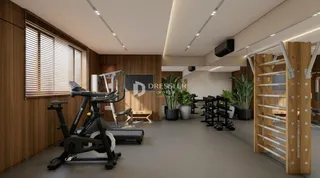 Imagem de uma área comum com equipamentos de ginástica em um imóvel.