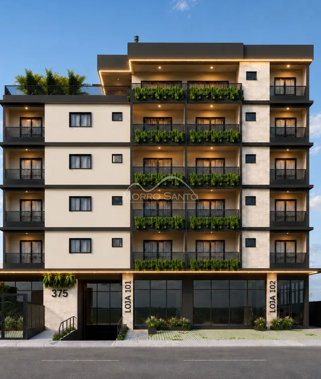 Fachada moderna de um prédio residencial em Lajeado, Brasil, com vários terraços e janelas.