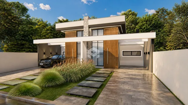 Fachada moderna de uma residência em Lajeado, Brasil, com jardim e garagem.