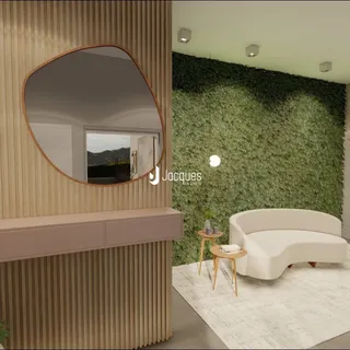 Sala de estar com parede verde e sofá branco.