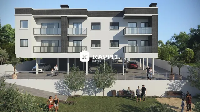 Fachada de um prédio residencial moderno em Lajeado, Brasil, com terraço e jardim.