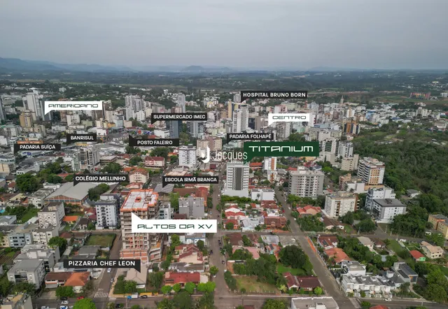 Vista aérea de uma área residencial em Lajeado, Brasil, mostrando vários edifícios e ruas.