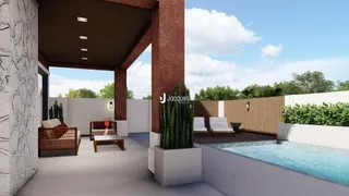 Vista de uma área externa com piscina e deck.