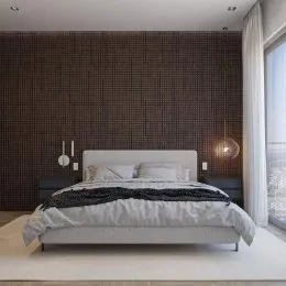 Quarto com cama de casal e parede texturizada.