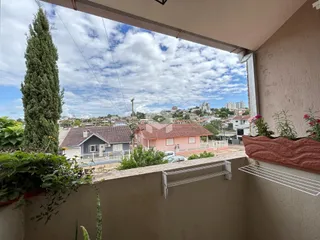 Vista da propriedade em Lajeado, Brasil, mostrando casas e paisagem urbana.
