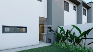 Fachada externa de uma residência branca com vegetação no primeiro plano.