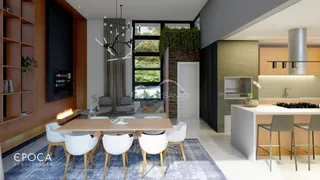 Sala de jantar moderna com mesa de madeira e cadeiras brancas em um ambiente bem iluminado.