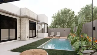 Vista da fachada de uma residência moderna com piscina e jardim em Lajeado.