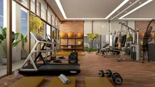 Sala de ginástica moderna com equipamentos de musculação e piso de madeira.